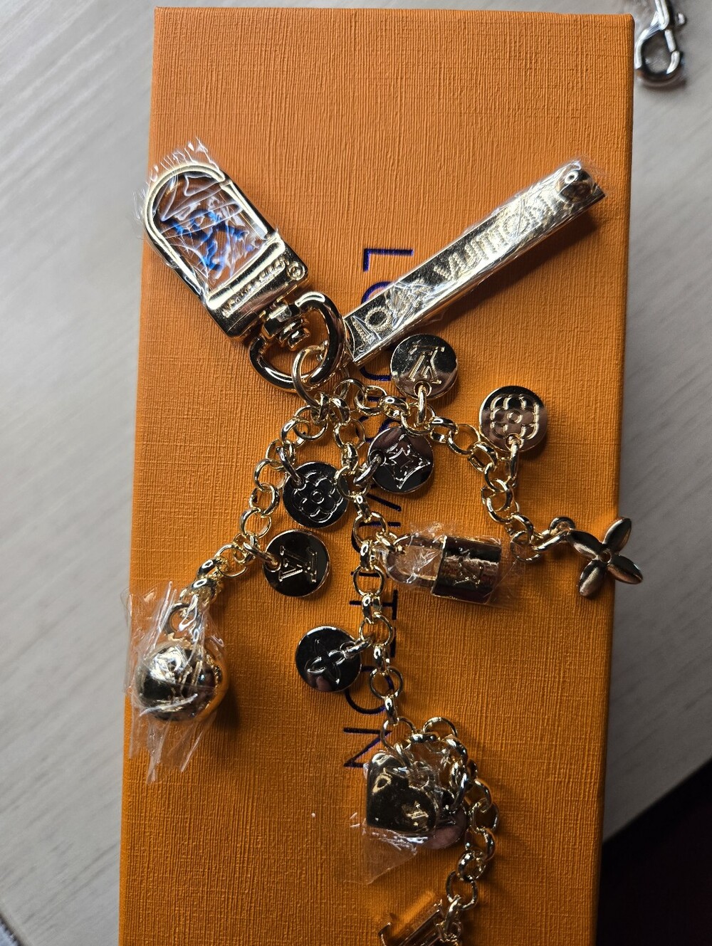 Louis Vuitton Gold-Tone Charm Keychain - Gold